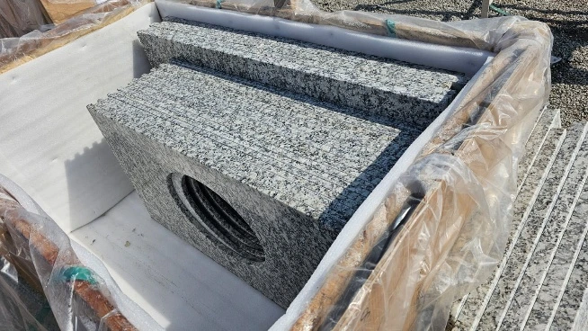 Inside view of a crate showing vanity tops with sink cutouts