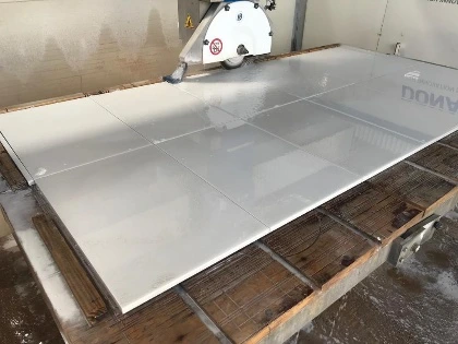 Finished cut pieces on a bridge cutter table